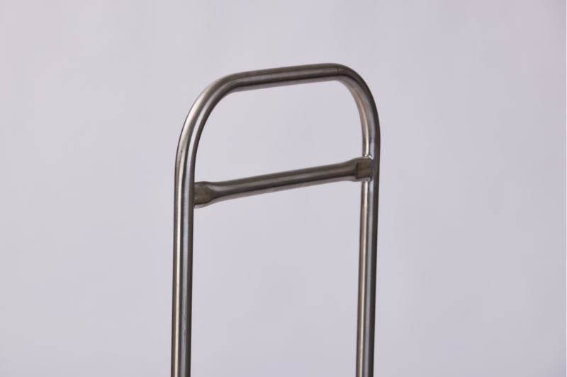 "A close-up image of a metal handlebar, designed with a simple and sturdy structure. The handlebar features a curved top and a horizontal support bar in the middle, against a plain white background.